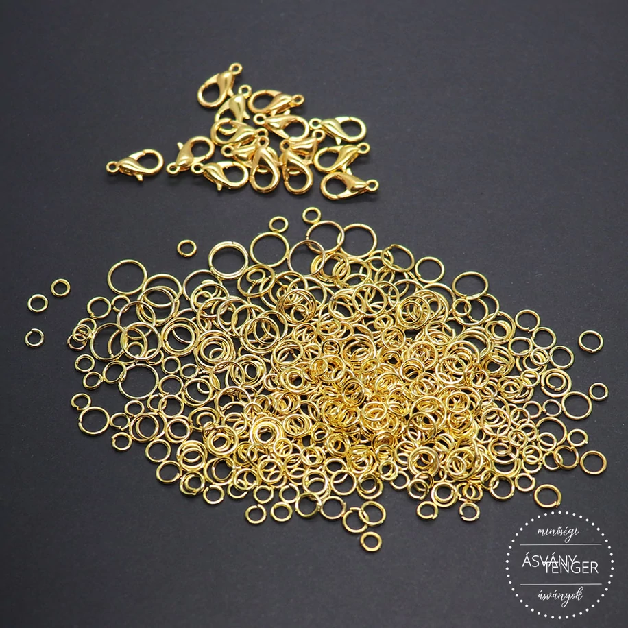 Karika és delfinkapocs szett arany színű 